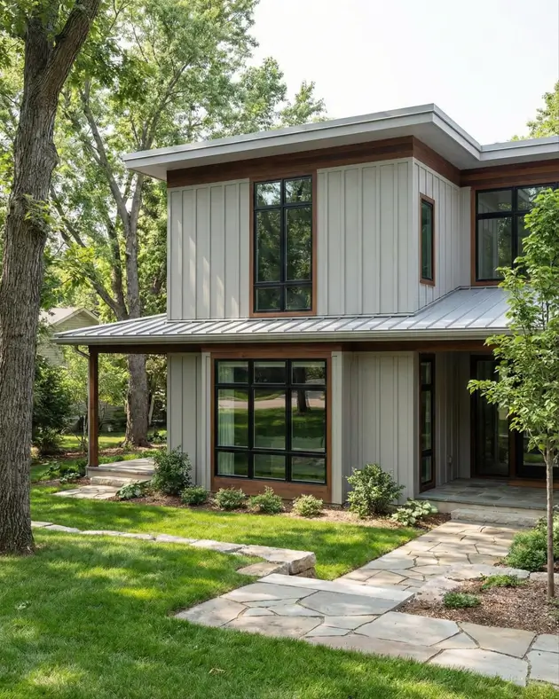 26 House with Board and Batten Siding Ideas for a Timeless Exterior 12 Modern board and batten exterior with flat roof and warm wood window frames.