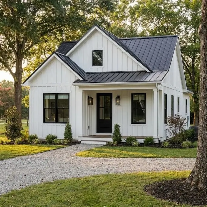 White Farmhouse With Black Trim: 34 Ideas for a Timeless Exterior 13 Dark metal roof contrasting with the siding on a small white farmhouse with black trim.