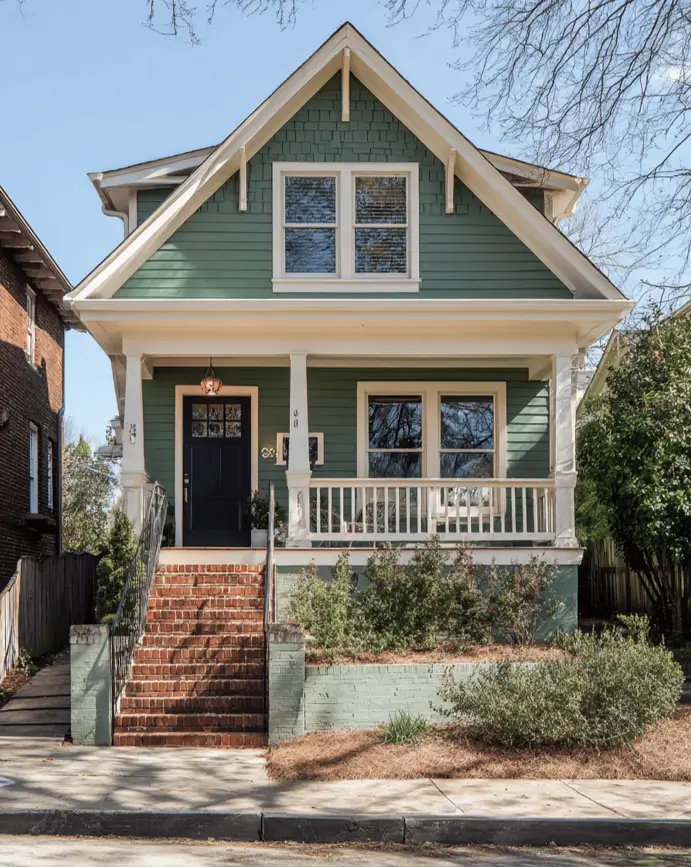 35 Small Craftsman House Ideas for Timeless Charm & Modern Living 17 Small Craftsman house with sage green shakes on a narrow lot.