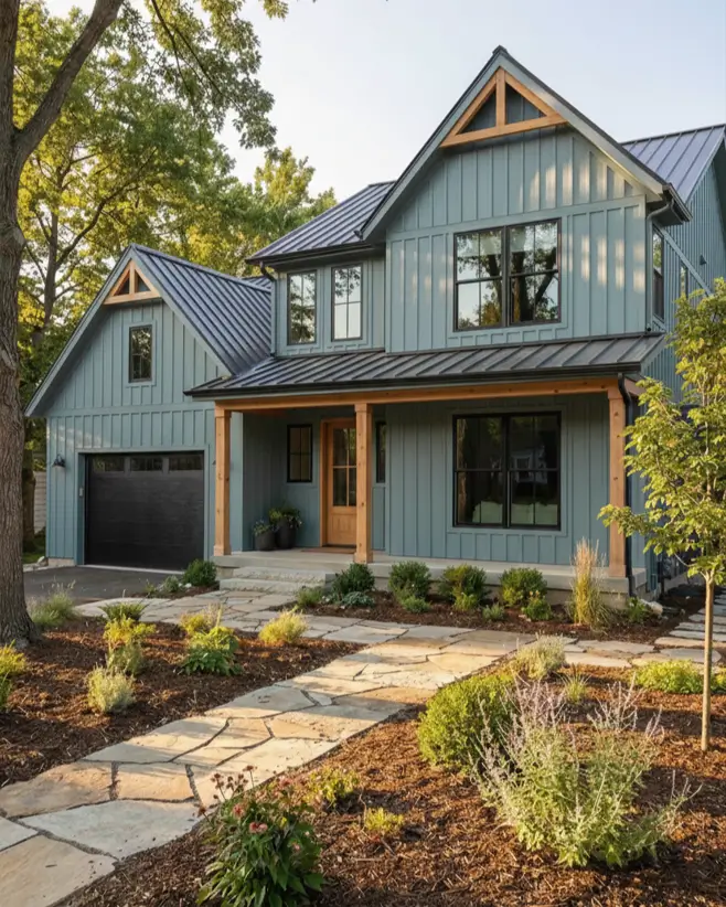 26 House with Board and Batten Siding Ideas for a Timeless Exterior 18 Two-story slate blue house with board and batten siding featuring natural wood trusses.