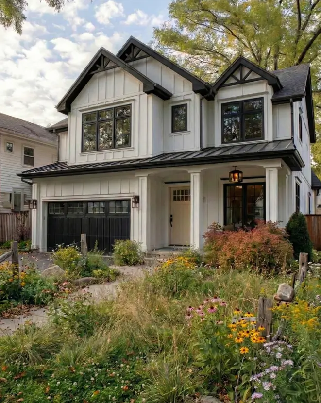 White Farmhouse With Black Trim: 34 Ideas for a Timeless Exterior 28 Wild prairie landscaping and tall grasses softening a white farmhouse with black trim.