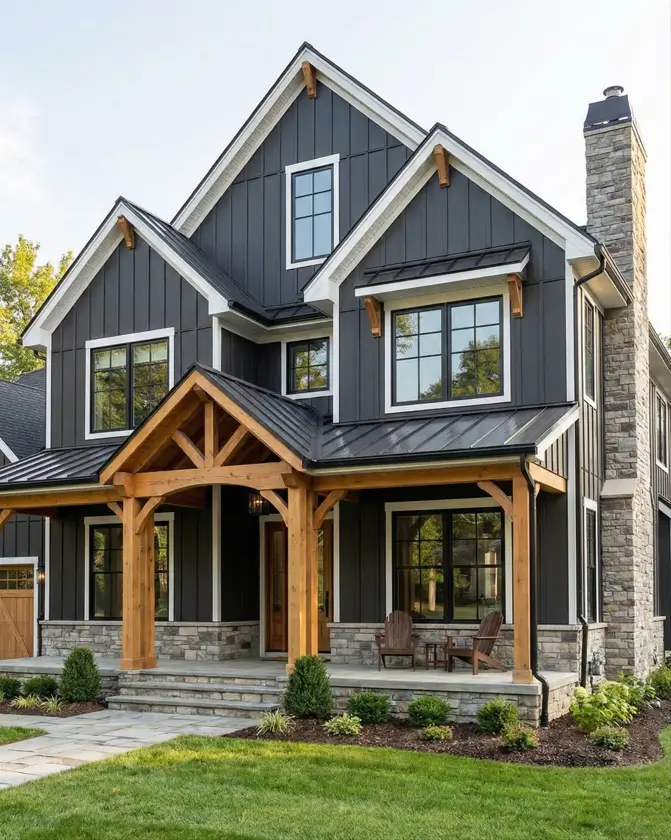 26 House with Board and Batten Siding Ideas for a Timeless Exterior 6 Charcoal house with board and batten siding featuring natural timber porch posts and a stone chimney.