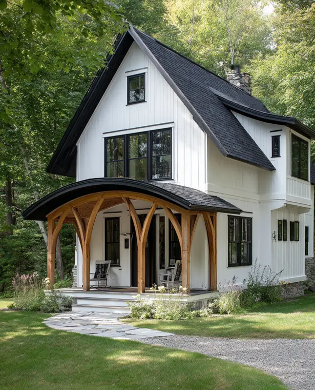 White Farmhouse With Black Trim: 34 Ideas for a Timeless Exterior 8 Curved timber-framed porch roof softening the lines of a modern farmhouse exterior.