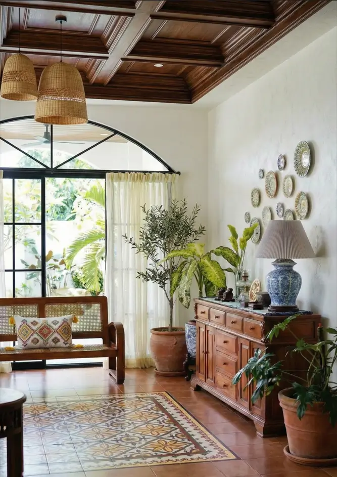 27 Modern Mediterranean Interior Design Ideas That Feel Effortlessly Chic 10 Living room design contrasting a heavy dark timber coffered ceiling with light walls and a curated wall-mounted plate collection.