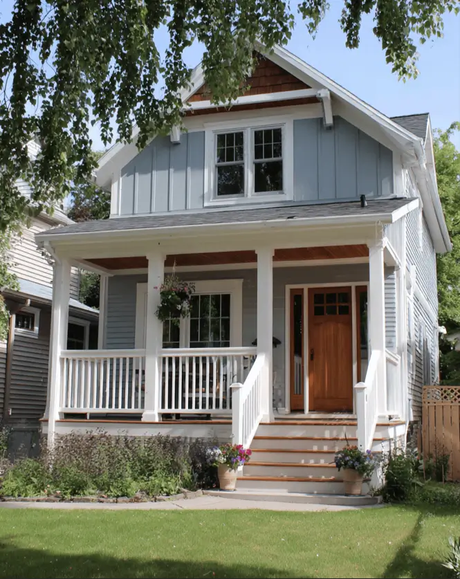 35 Small Craftsman House Ideas for Timeless Charm & Modern Living 11 Tiny house Craftsman-style with light blue vertical siding and cedar accents.