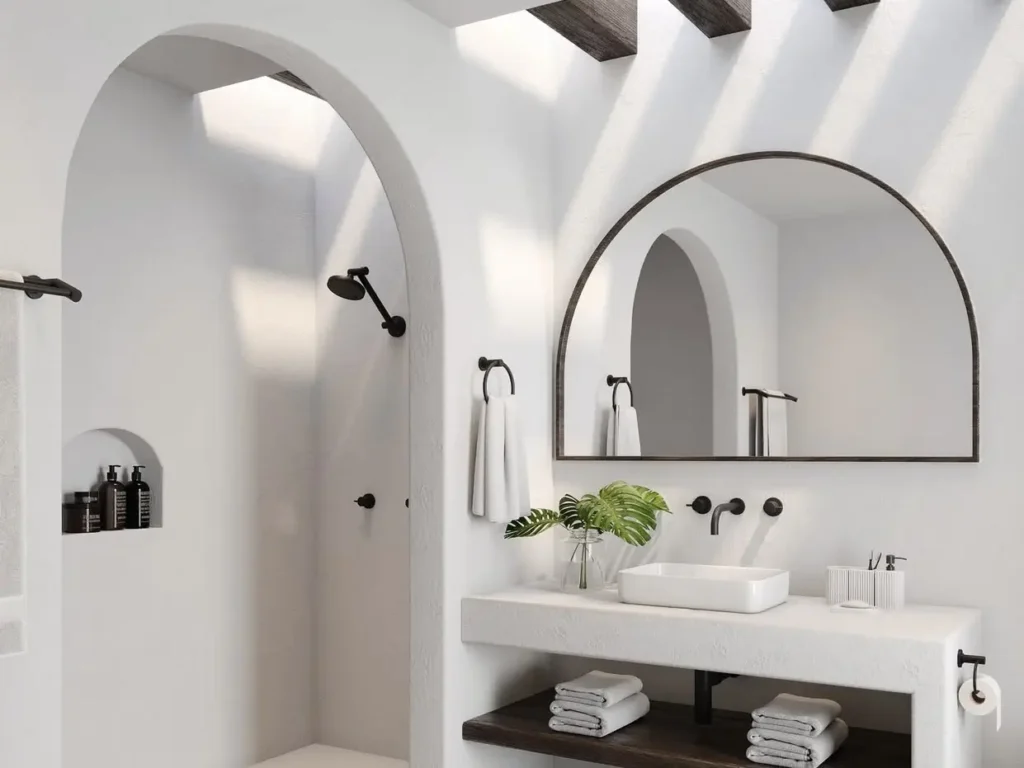 30 Mediterranean Bathroom Ideas for a Modern Coastal Escape 94 Sun-drenched modern Mediterranean bathroom featuring tactile travertine walls, arched architecture, and warm natural light, illustrating the perfect coastal escape.