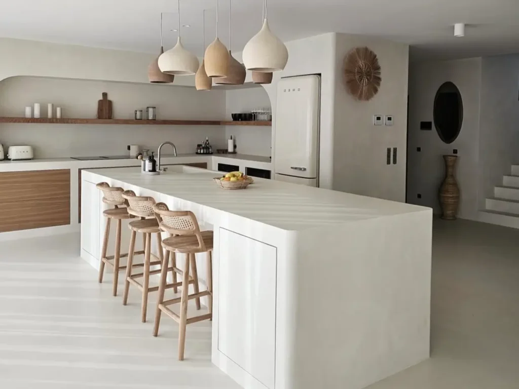 30 Mediterranean Kitchen Ideas for a Warm, Coastal Escape 65 Modern Mediterranean kitchen design featuring warm earthy textures, natural stone surfaces, and rustic wood accents that embody a relaxed coastal aesthetic.