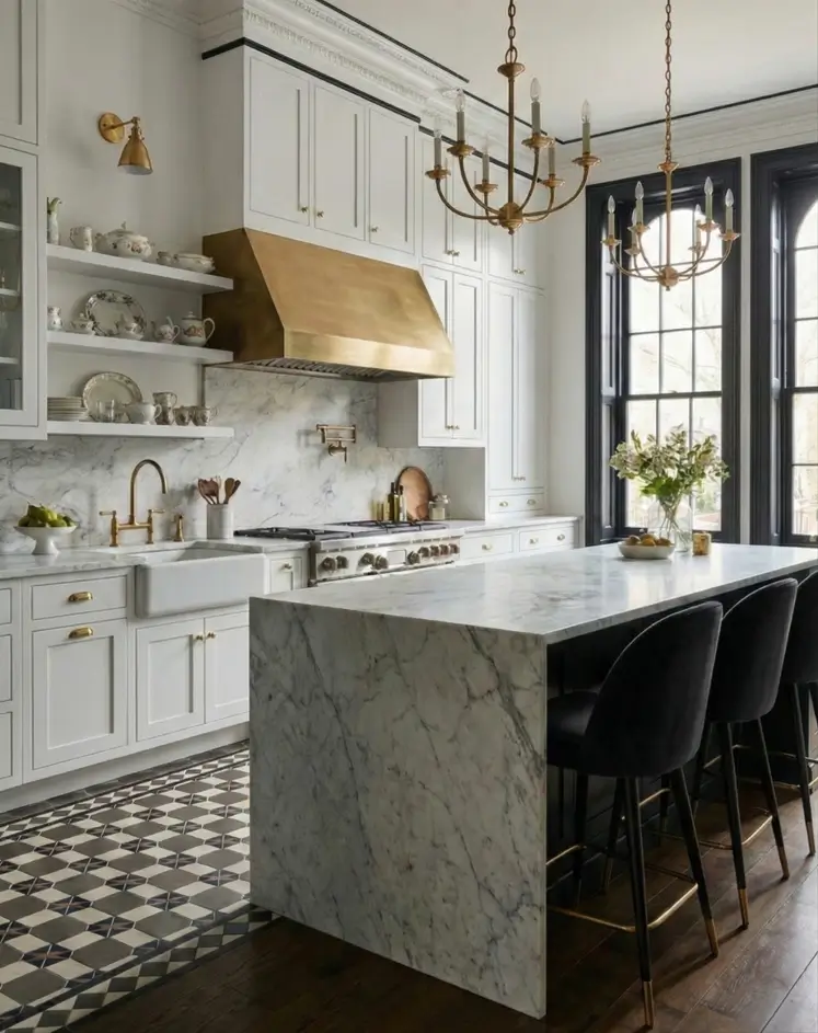 30 Modern Victorian Home Interior Ideas That Feel Timeless 20 Large brass range hood serves as a focal point in this white kitchen featuring marble surfaces and checkered flooring.