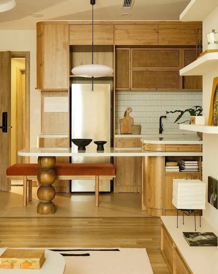 Japandi Kitchen: The Calm, Warm Look I Keep Coming Back To 3 Woven cane cabinet fronts above warm oak cabinetry and a white stone counter