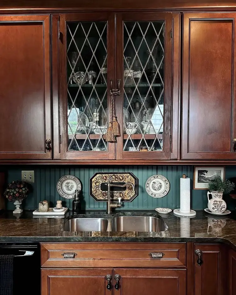 Victorian Kitchen Design: 40 Ideas a Designer Actually Loves 3 Victorian kitchen cabinets with leaded diamond glass doors, mahogany wood, green beadboard backsplash, and transferware