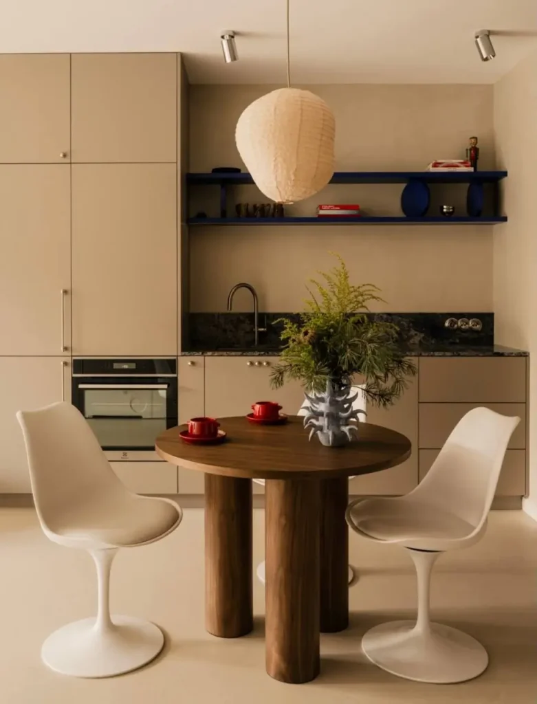 16 Kitchen Color Combination Ideas That Feel Right at Home 16 Beige kitchen cabinets with bold cobalt blue floating shelves