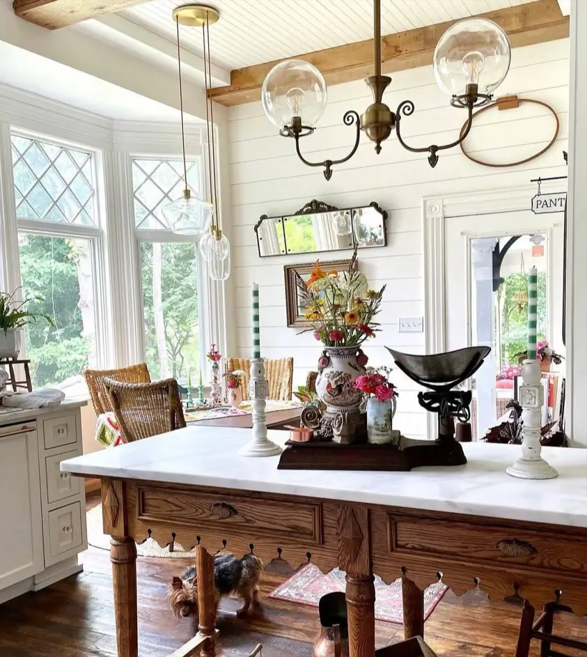 Victorian Kitchen Design: 40 Ideas a Designer Actually Loves 17 Victorian style kitchen with marble-topped antique table island, leaded diamond windows, and brass scroll-arm light fixture