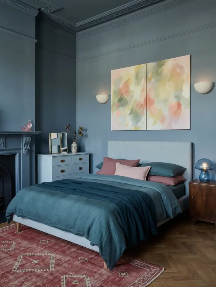 Victorian Style Bedroom: 30 Ideas for Romance Without the Heaviness 18 Modern Victorian style bedroom with colour-drenched slate-blue cornicing, cast-iron fireplace, and teal linen bedding