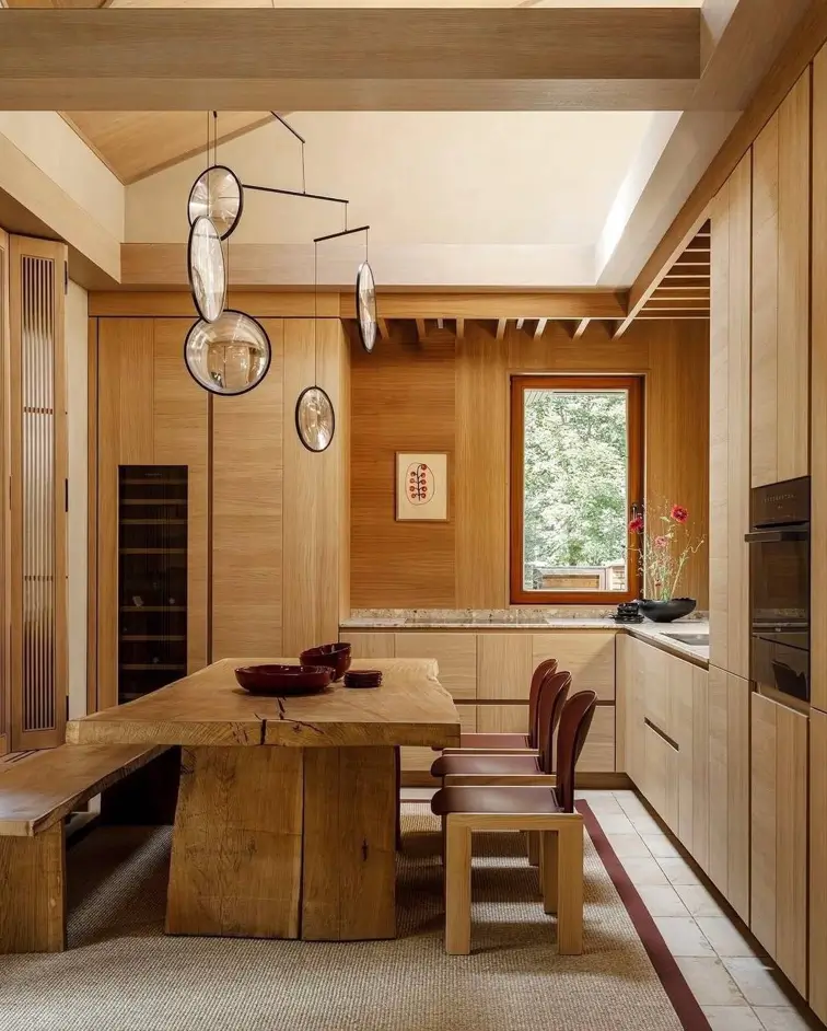 Japandi Kitchen: The Calm, Warm Look I Keep Coming Back To 4 Japandi kitchen wrapped in floor-to-ceiling oak cabinetry with a live-edge dining table