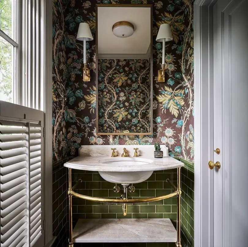 Colonial Interior Design Style: American vs. British (33 Real-Home Ideas) 28 British Colonial powder room with dark botanical wallpaper, plantation shutters, and brass marble washstand