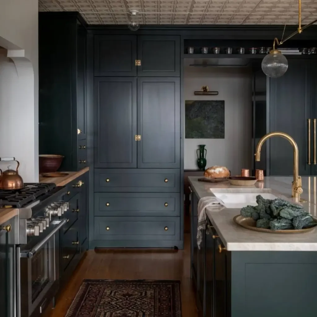 Victorian Kitchen Design: 40 Ideas a Designer Actually Loves 36 Dark green Victorian kitchen with pressed-tin ceiling, brass hardware, range cooker, and marble island