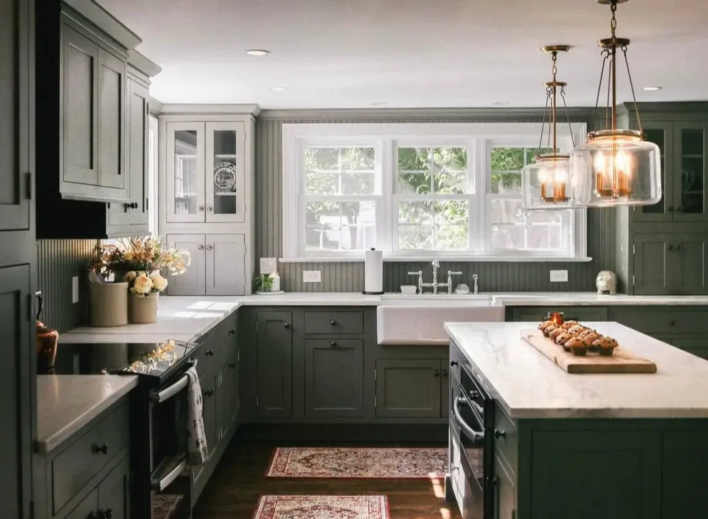 Colonial Style Kitchen: 26 Timeless Ideas, Cabinets & Designs 6 Colonial farmhouse kitchen with sage green Shaker cabinets, a beadboard backsplash, and an apron sink