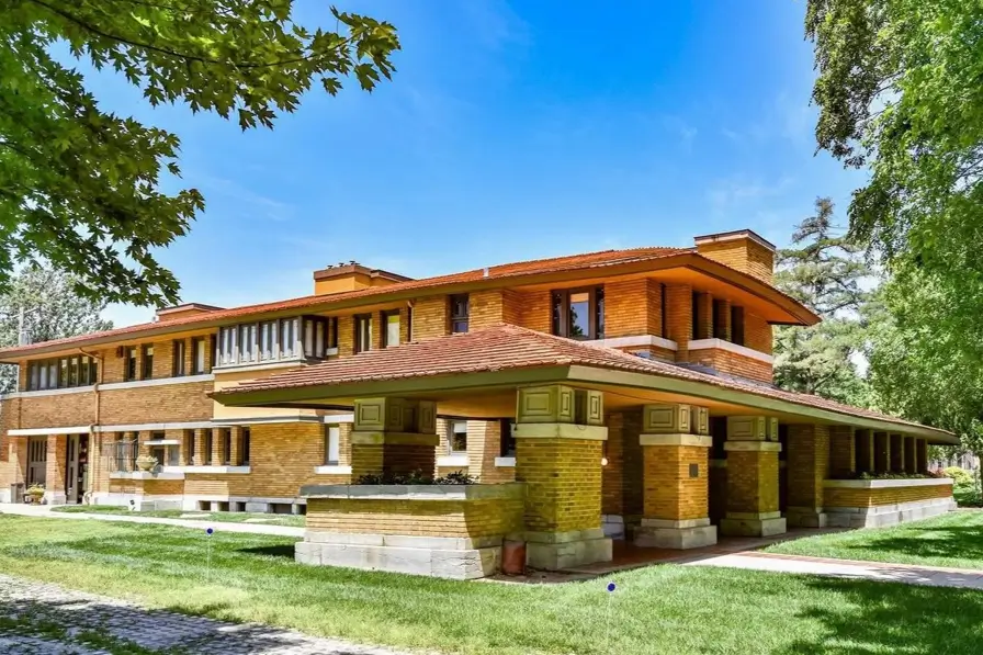 Prairie House Style: Key Features, History, and What Makes These Homes So Timeless 3 Prairie house style exterior with terracotta hipped roofs, Roman brick walls, and deep overhanging eaves