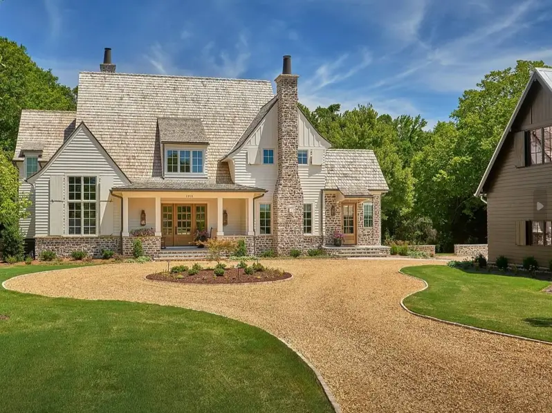 White Farmhouse with Stone Exterior: 29 Ideas That Feel Warm, Not Cold 3 White farmhouse with stone exterior featuring a full-height fieldstone chimney and stone wainscot base