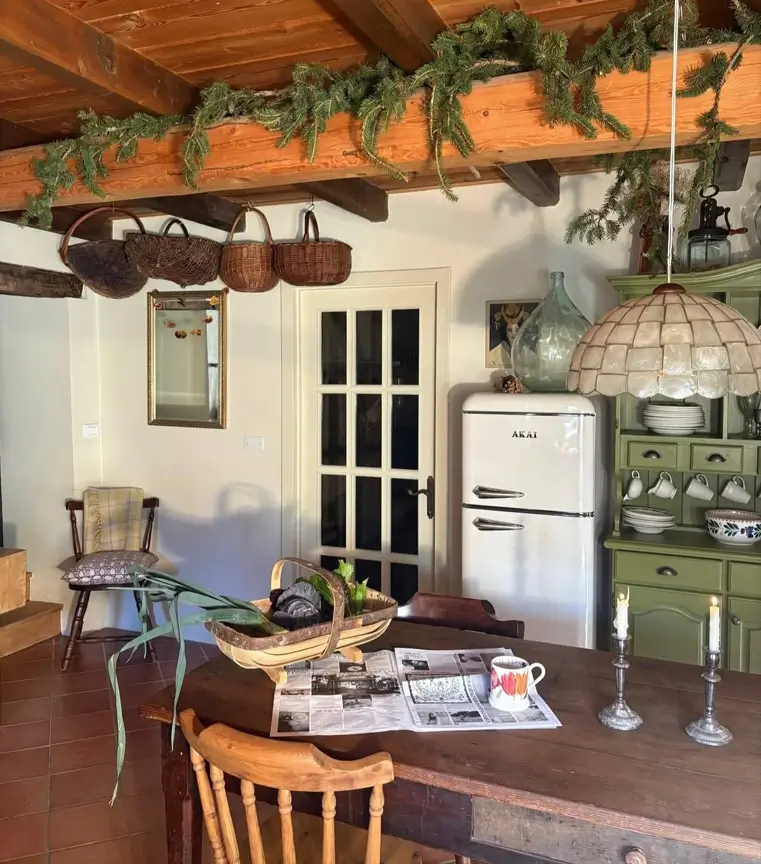 Farmhouse Kitchen Design Ideas: 36 Ways to Get the Look 20 Farmhouse kitchen decor with an olive-green painted hutch, retro fridge, vintage baskets, and terracotta floor