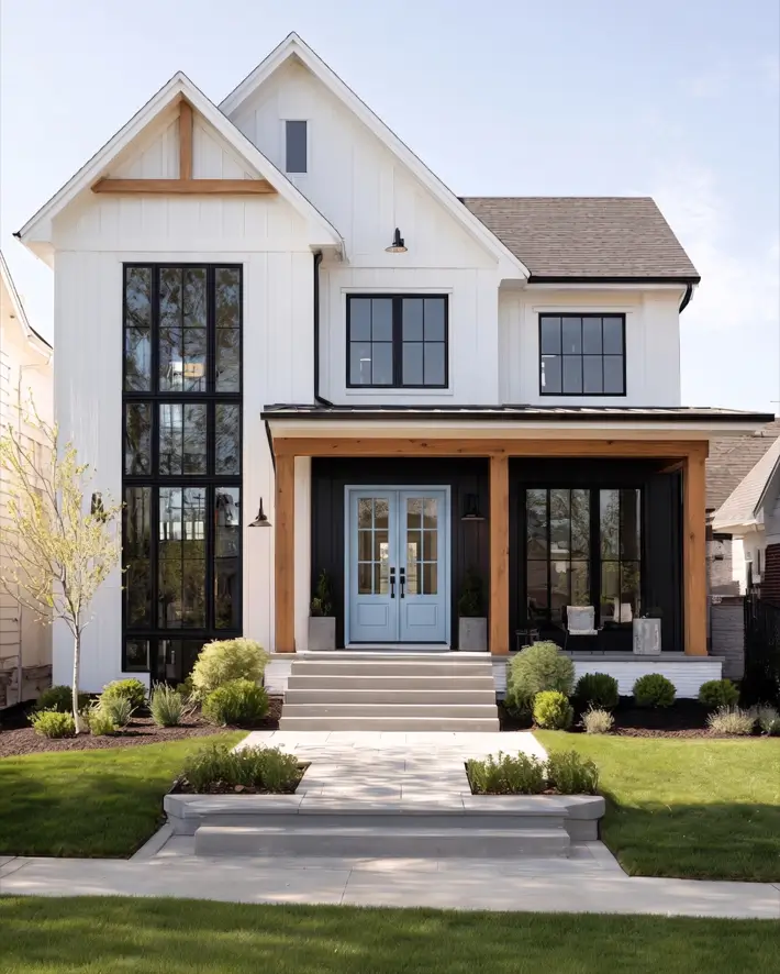 47 White Houses With Black Trim and Wood Accents We Love 20 White house with black trim and wood accents showing a cedar-framed porch and black-framed windows