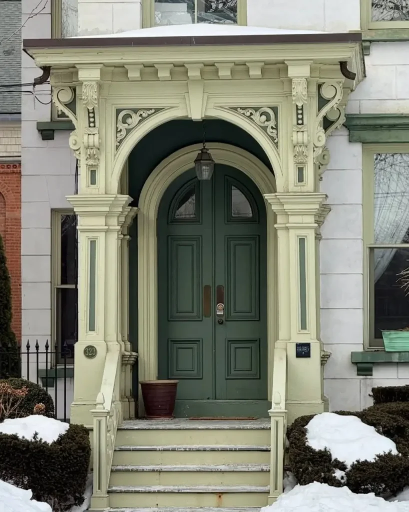 Italianate Style House: 33 Ideas and the Details That Give One Away 4 Carved entry arch on an Italianate style house with acanthus consoles, pierced scrollwork and green double doors