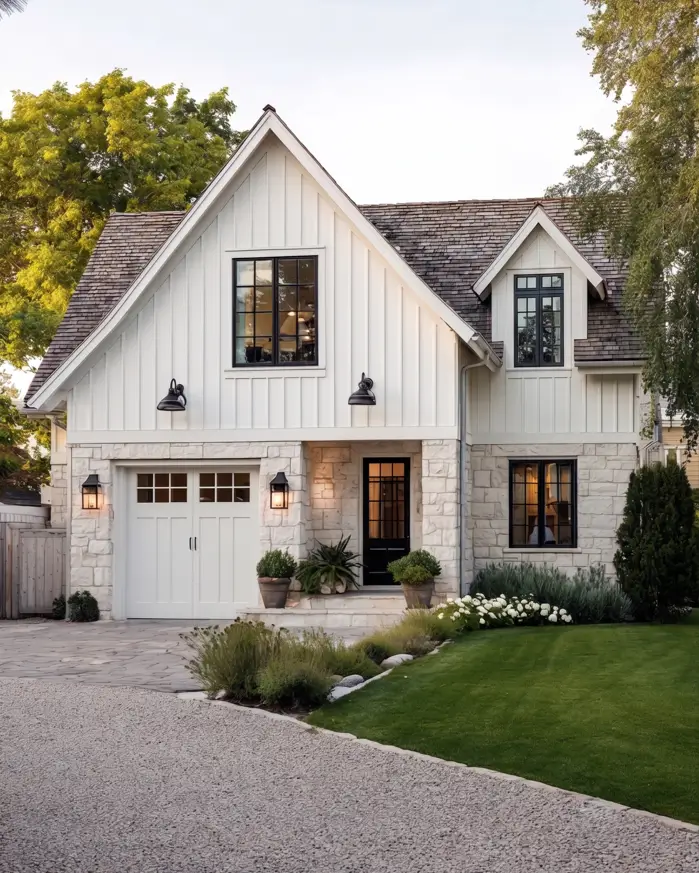 White Farmhouse with Stone Exterior: 29 Ideas That Feel Warm, Not Cold 24 Whitewashed limestone lower story matching cream siding on a tone-on-tone farmhouse exterior