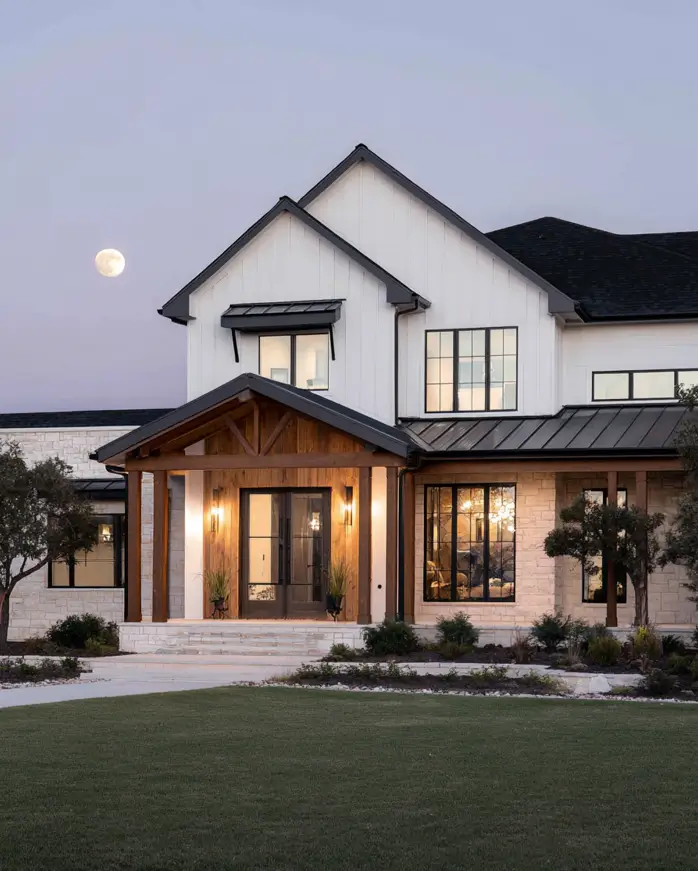 47 White Houses With Black Trim and Wood Accents We Love 24 Cedar king-post timber porch on a limestone base fronting a white farmhouse