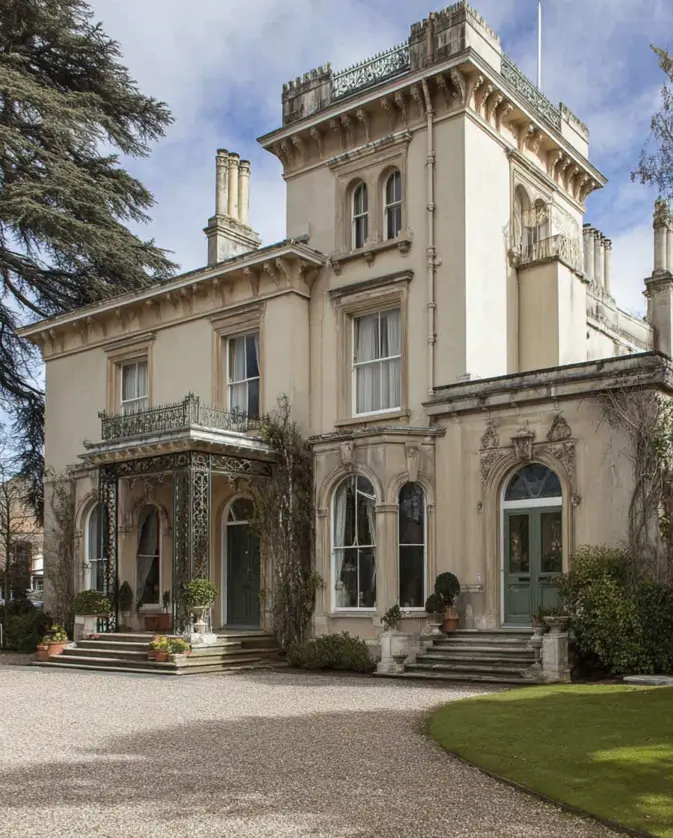 Italianate Style House: 33 Ideas and the Details That Give One Away 25 British Italianate style house in cream render with a lace ironwork veranda and a decorated parapet