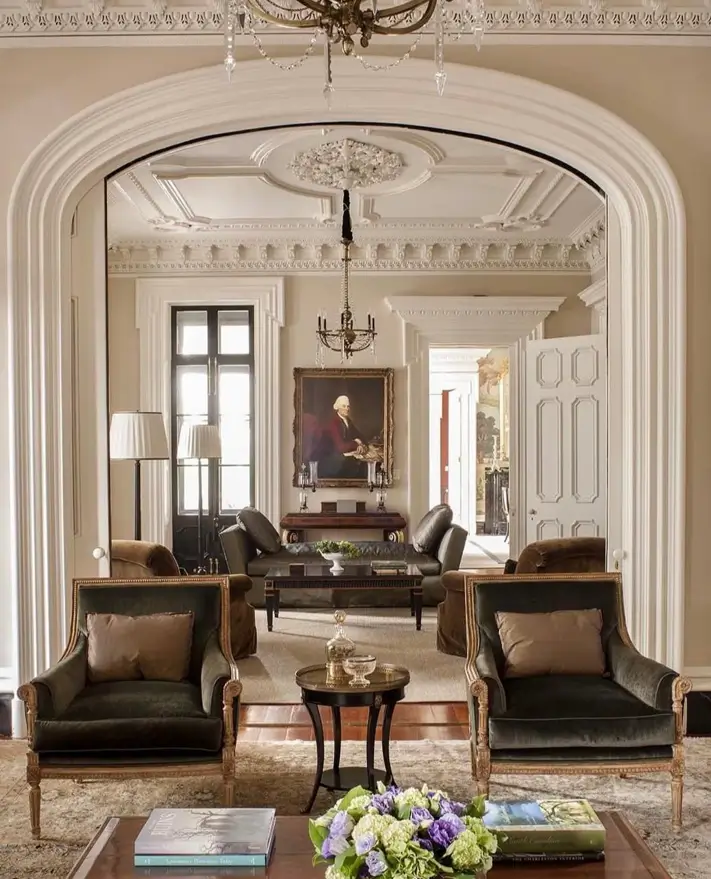 Italianate Style House: 33 Ideas and the Details That Give One Away 32 Italianate style house interior showing a double parlor joined by a wide plaster arch under a dentil cornice