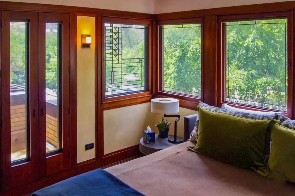 Prairie House Style: Key Features, History, and What Makes These Homes So Timeless 32 Corner casement windows and an art glass panel in a Prairie style bedroom