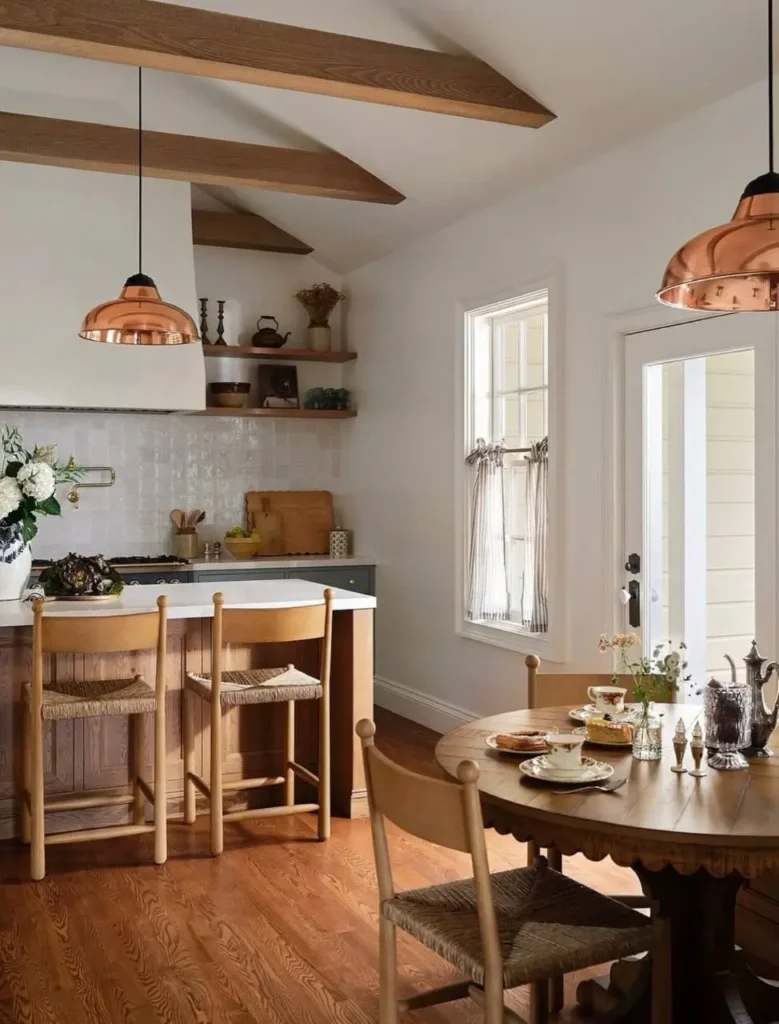 Italianate Style House: 33 Ideas and the Details That Give One Away 34 Renovated kitchen in an Italianate style house with exposed beams, painted cabinets and copper pendants
