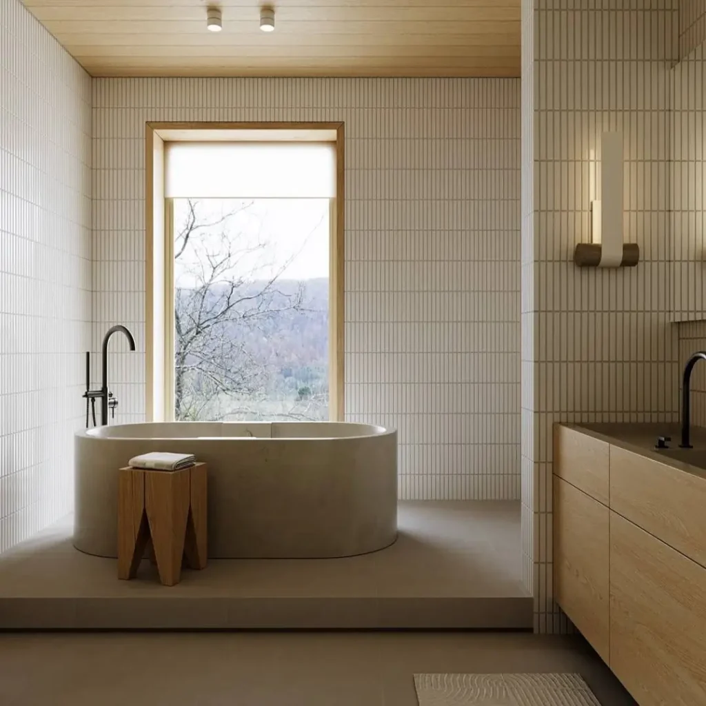 38 Japandi Style Bathroom Ideas for a Quietly Beautiful Space 6 Japandi style bathroom with a concrete tub on a raised plinth, finger tile walls, and a timber ceiling