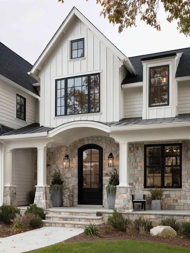 White Farmhouse with Stone Exterior: 29 Ideas That Feel Warm, Not Cold 8 White farmhouse with stone exterior arched portico entry with stone porch walls and a black arched door