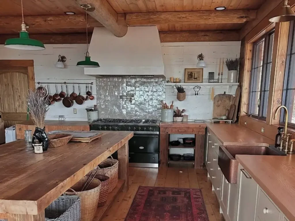 Farmhouse Kitchen Design Ideas: 36 Ways to Get the Look 64 Rustic farmhouse kitchen design ideas with reclaimed wood counters, a black range, copper pots, apron sink, and vintage rug