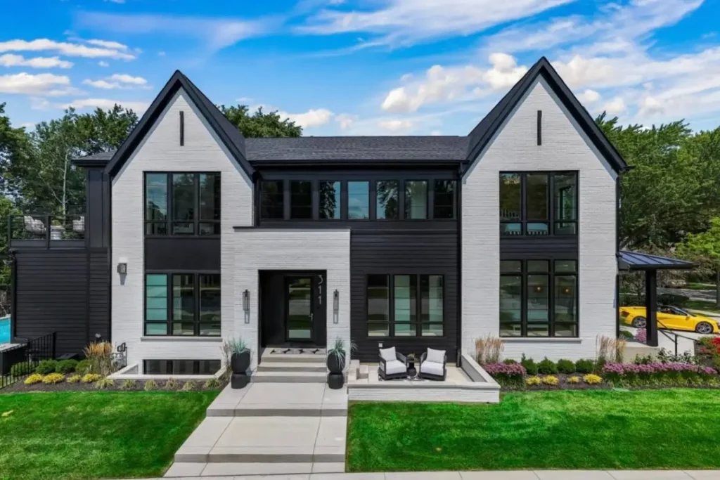 46 Modern Black and White House Exterior Ideas for a Timeless Look 3 Modern black and white house exterior with white brick, twin gables, and black window frames