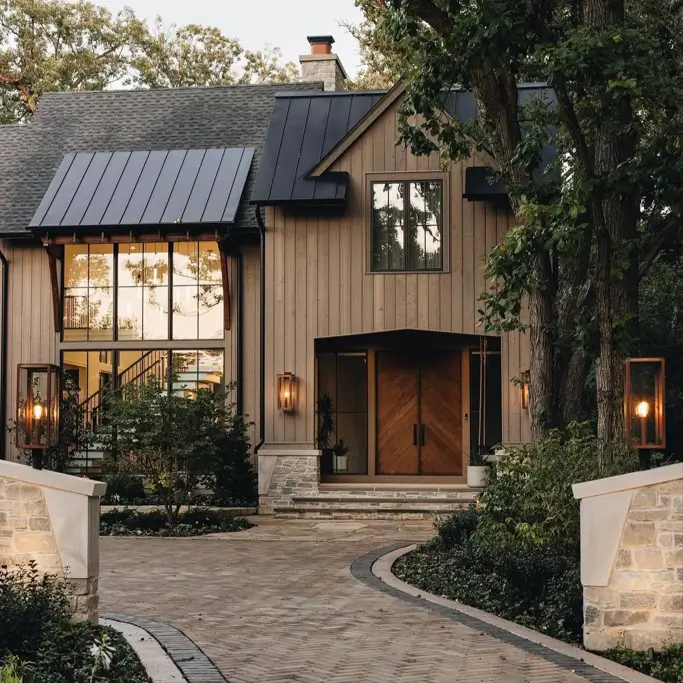 37 Brown House with Black Trim Ideas for a Warm, Modern Exterior 13 Light brown house with black trim, warm wood board siding under a charcoal metal roof with dark-framed windows
