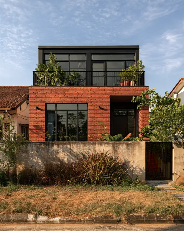 46 Red Brick House With Black Trim Ideas for Standout Curb Appeal 13 Modern red brick house with black trim and a dark glazed upper volume