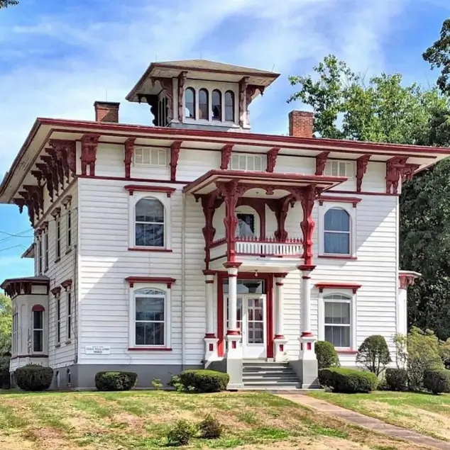 White House with Red Trim: 27 Ideas and How to Pick Your Red 13 White clapboard Italianate house with scrolled red eave brackets and red-trimmed arched windows