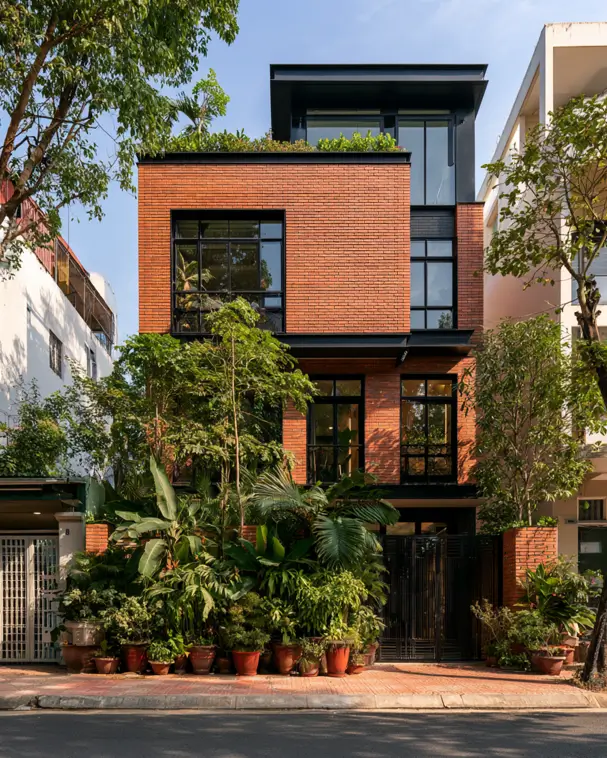 46 Red Brick House With Black Trim Ideas for Standout Curb Appeal 14 Modern red brick townhouse with black trim and a glazed rooftop garden volume