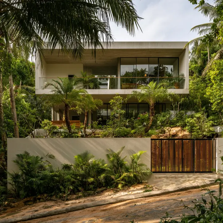 Hillside House Design: 38 Ideas for Building With the Slope 15 concrete modern hillside house design on a downhill jungle lot with a terraced tropical garden