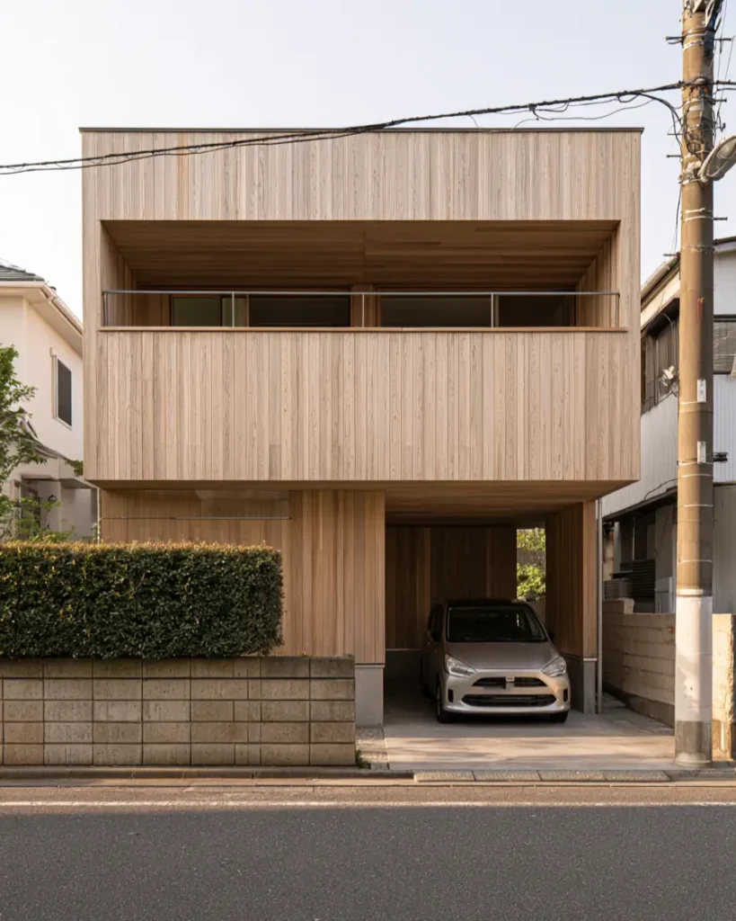 Modern Japanese House Design: 58 Ideas, Costs, and What Defines the Style 21 Pale cedar cladding wrapping the walls, soffit and carport ceiling of a modern Japanese wooden house.