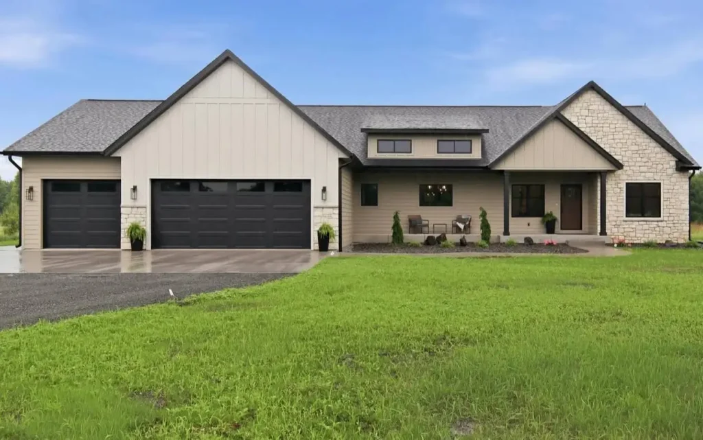 40 Tan House With Black Trim Exteriors Worth Copying 22 Tan house with black trim, black garage doors, stone accents, and dark-framed windows on a ranch