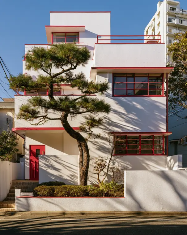 White House with Red Trim: 27 Ideas and How to Pick Your Red 25 Stepped white modernist house with signal-red parapet lines and red-framed grid windows