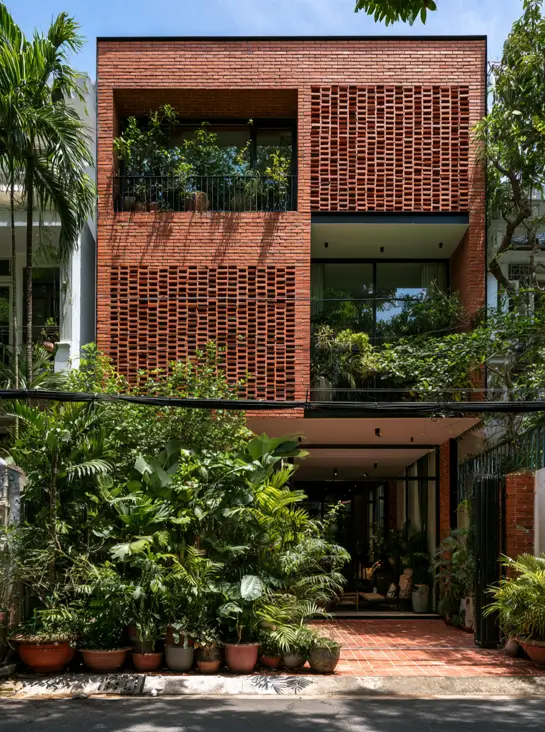 46 Red Brick House With Black Trim Ideas for Standout Curb Appeal 27 Modern red brick house with black trim and perforated brick screen panels