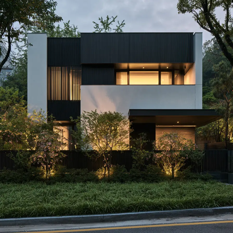 46 Modern Black and White House Exterior Ideas for a Timeless Look 30 Modern black and white house exterior with a black slat screen over white stucco at dusk