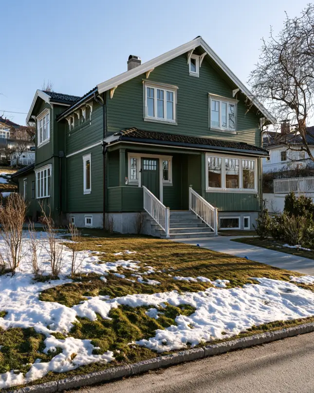 43 Green House With White Trim Ideas for Fresh Curb Appeal 33 hunter green house with white trim, many-paned white windows, and white porch railings on a Scandinavian home