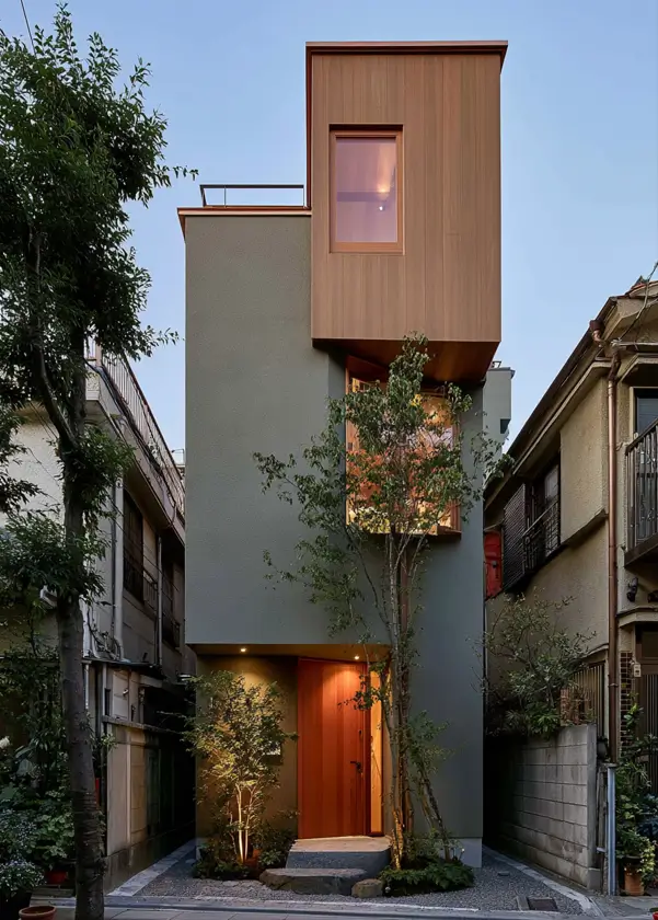 Modern Japanese House Design: 58 Ideas, Costs, and What Defines the Style 33 A small modern Japanese house in sage green render with a cedar-clad top volume.