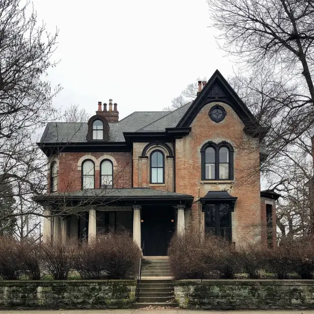 46 Red Brick House With Black Trim Ideas for Standout Curb Appeal 37 Red brick Victorian house with black trim outlining arched windows and gable