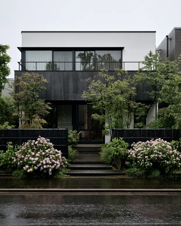 46 Modern Black and White House Exterior Ideas for a Timeless Look 38 Dark wood-clad box between white bands framed by layered greenery